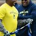 Former Michigan football players Gerald White and Carlitos Bostic share a laugh during the annual alumni flag football game before spring practice at Michigan Stadium on Saturday, April 13, 2013. Melanie Maxwell I AnnArbor.com